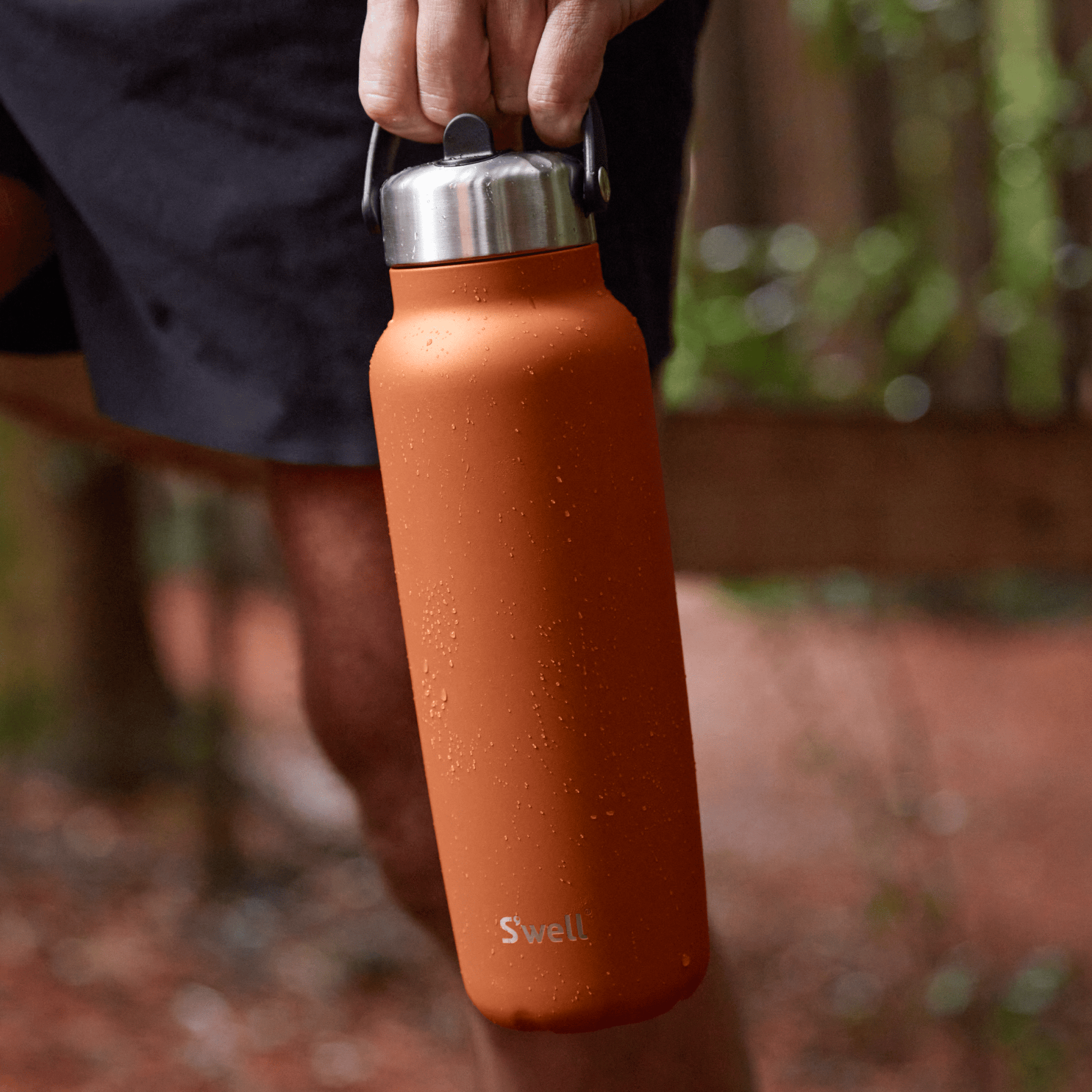 explorer-with-flip-straw-lid-40oz-u3 Swell-Explorer-Water-Bottle-40oz-Orange-Carnelian-LifeStyle.png